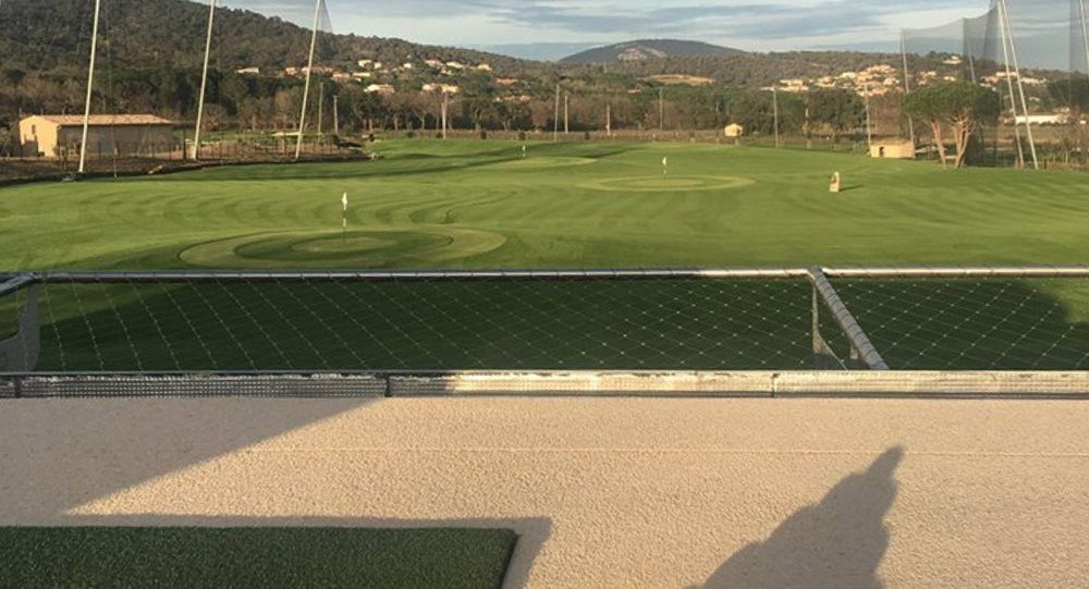 Augusta Synthetic turf beside natural grass golf course