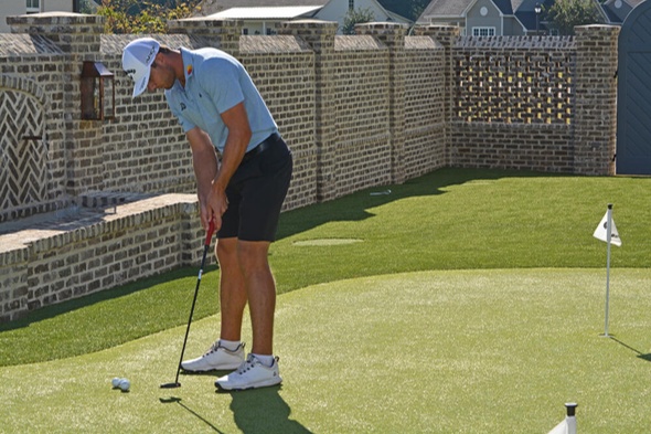 Augusta Golfer putting on synthetic grass